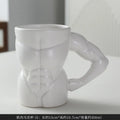 Matte black ceramic mug with muscle design and 300ml capacity