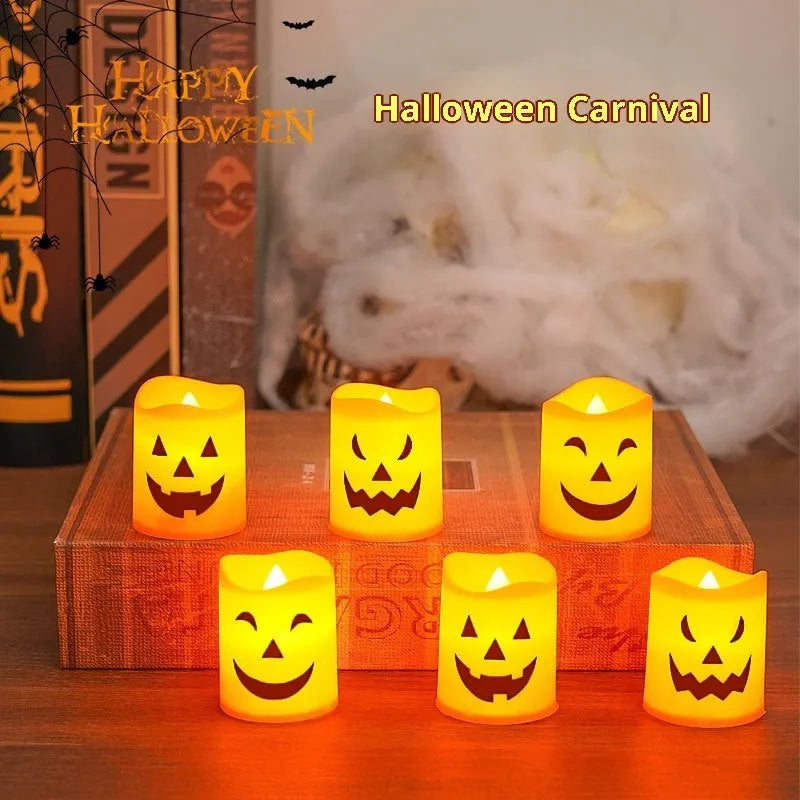 Set of six pumpkin-coloured plastic electric candle lamps arranged for Halloween decoration