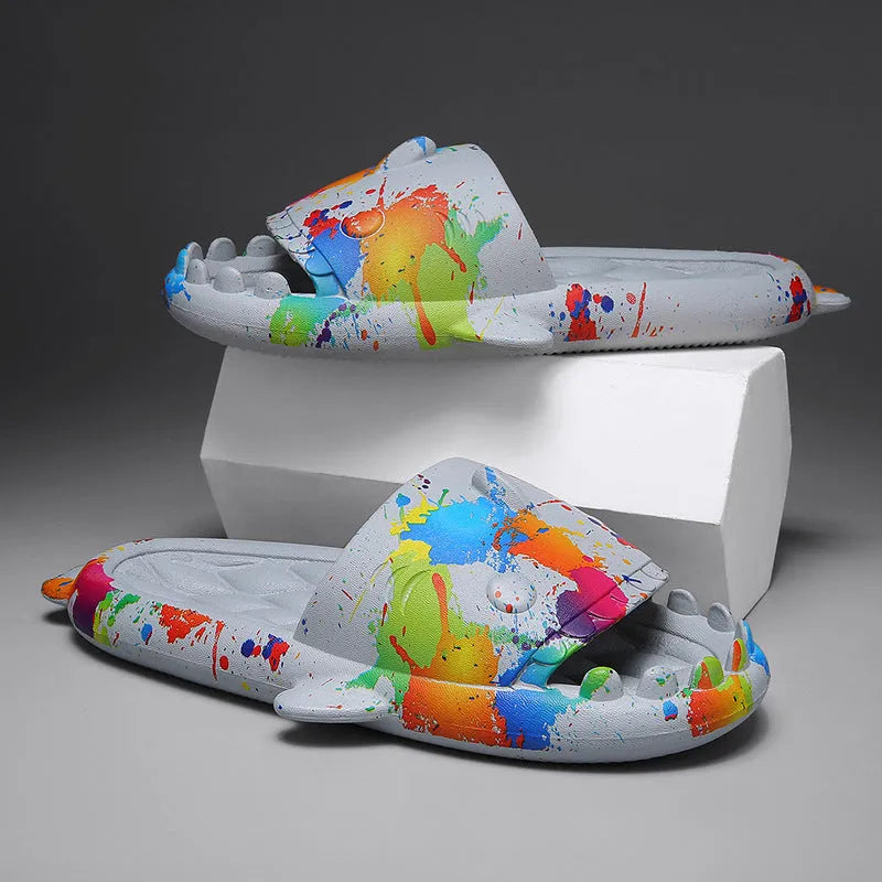 Pair of open-toe EVA slippers with a shark couple design on the footbed.