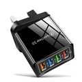 Four-port USB wall charger with UK three-pin plug in black and white colour scheme