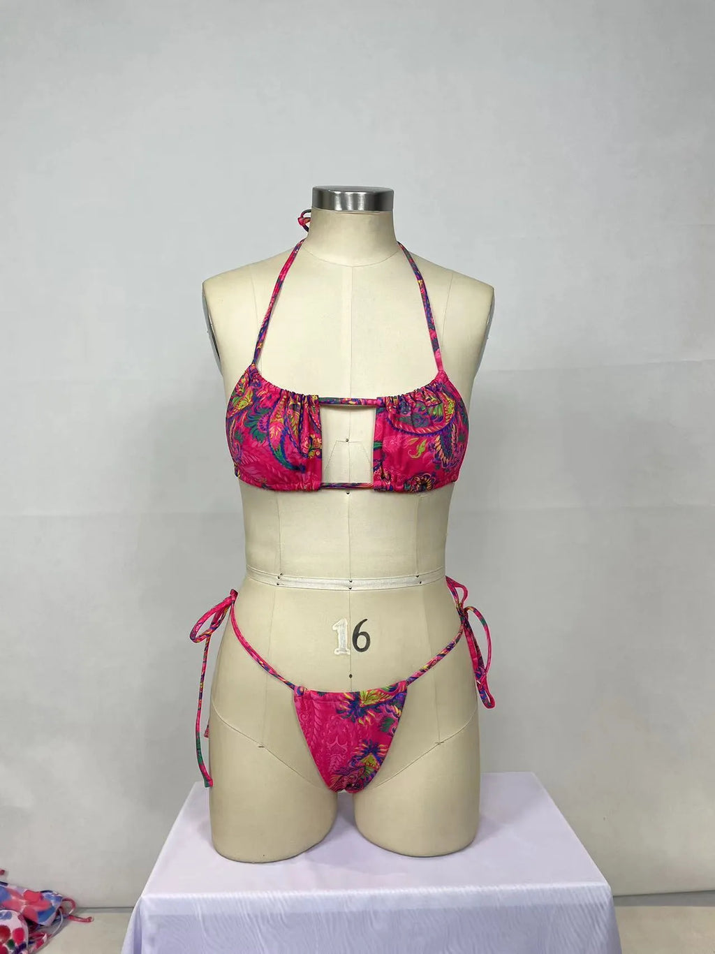 Pink women's nylon bikini two-piece set with triangle top and briefs for swimming.