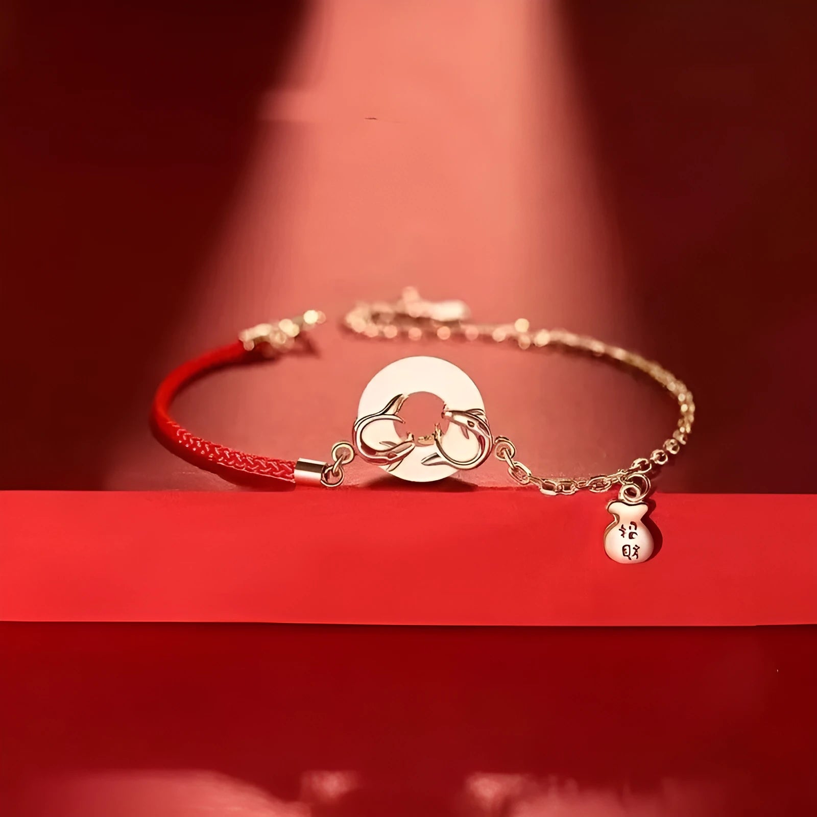 Festive koi bracelet with peace buckle fastening, adjustable red rope and fish tail decorative elements