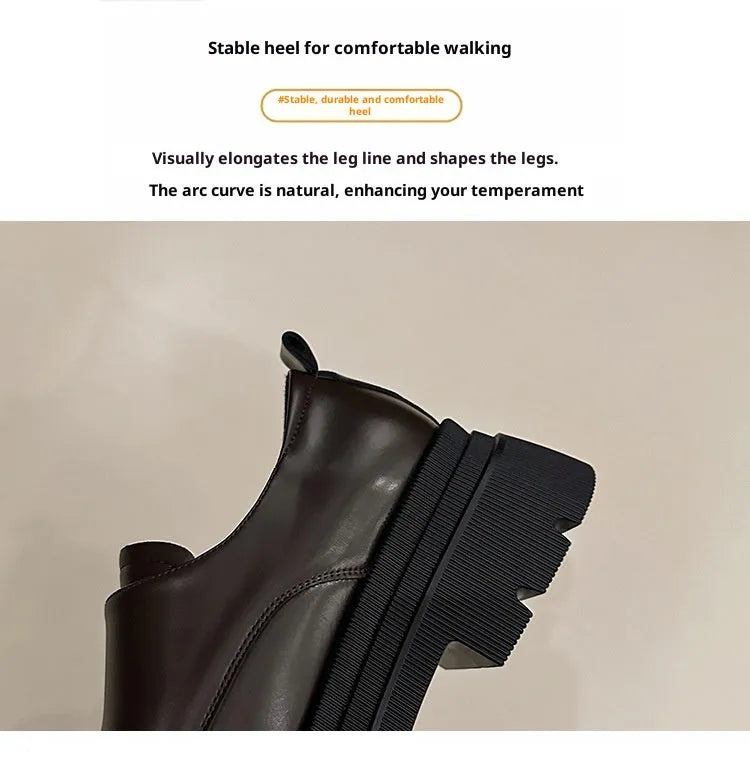 Women's black chunky heel shoes with square heel and cross strap on a plain background