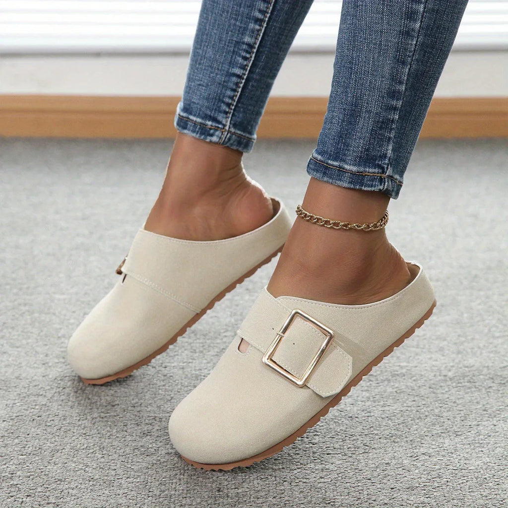 Women's brown closed toe low top canvas slipper shown from the side