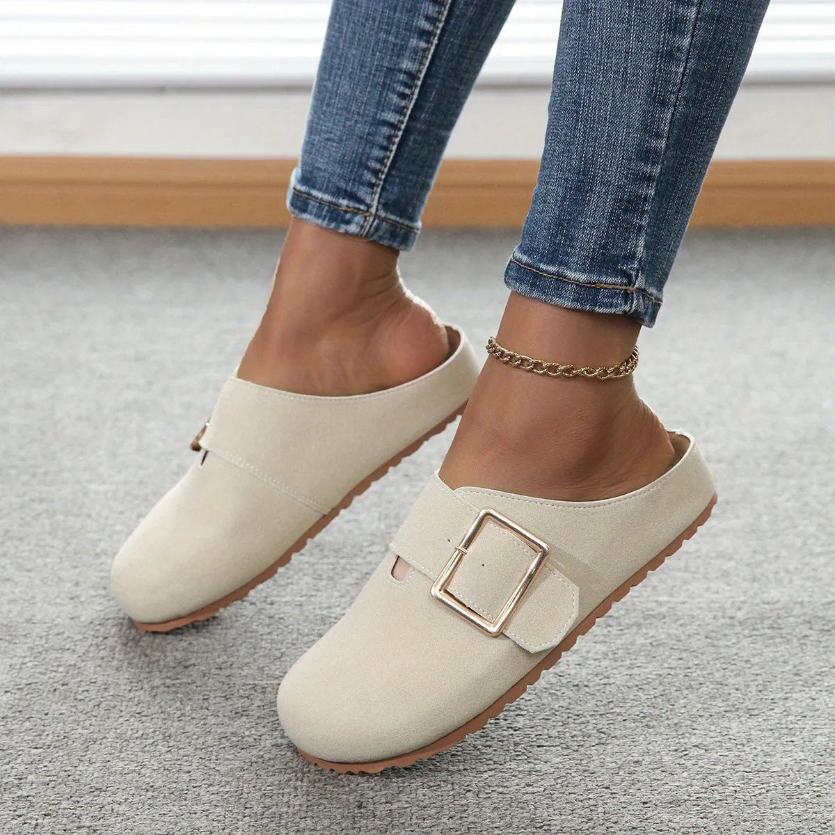 Women's brown closed toe low top canvas slipper shown from the side