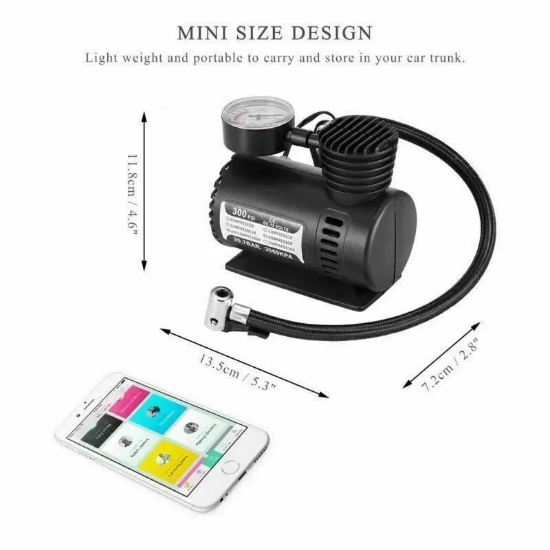 Black portable 12V mini car air compressor with pressure gauge, hose, and two nozzle adapters on grey background