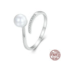 Women's S925 sterling silver adjustable ring with a natural pearl on an open loop.