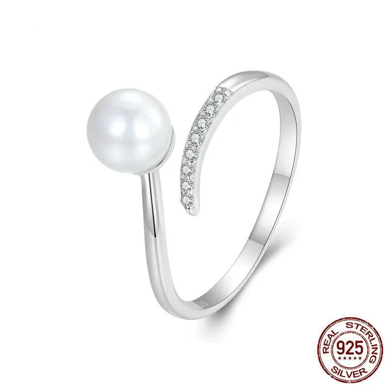 Women's S925 sterling silver adjustable ring with a natural pearl on an open loop.