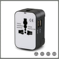 Black universal travel adapter plug with USB port and child safety door for international power conversion