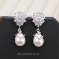 Women's drop-shaped pearl earrings with genuine freshwater pearl inlay and zircon accents on 18K gold-plated copper