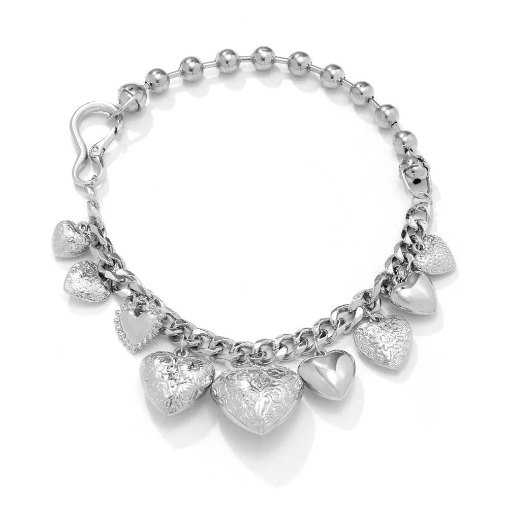 Carved heart pendant necklace in alloy metal with adjustable chain length between 41cm and 50cm