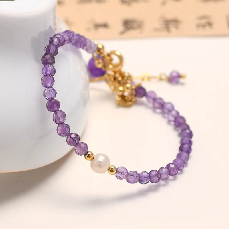 Amethyst-coloured Chinese-style women's crystal bracelet with electroplated finish and diamond shape.