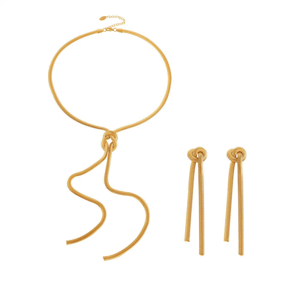 Gold knotted tassel snake chain long necklace with matching electroplated earrings on titanium steel