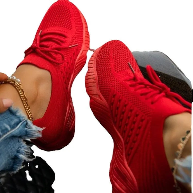 Women's solid colour sneakers with a thick sole, shown in one of nine available colours.