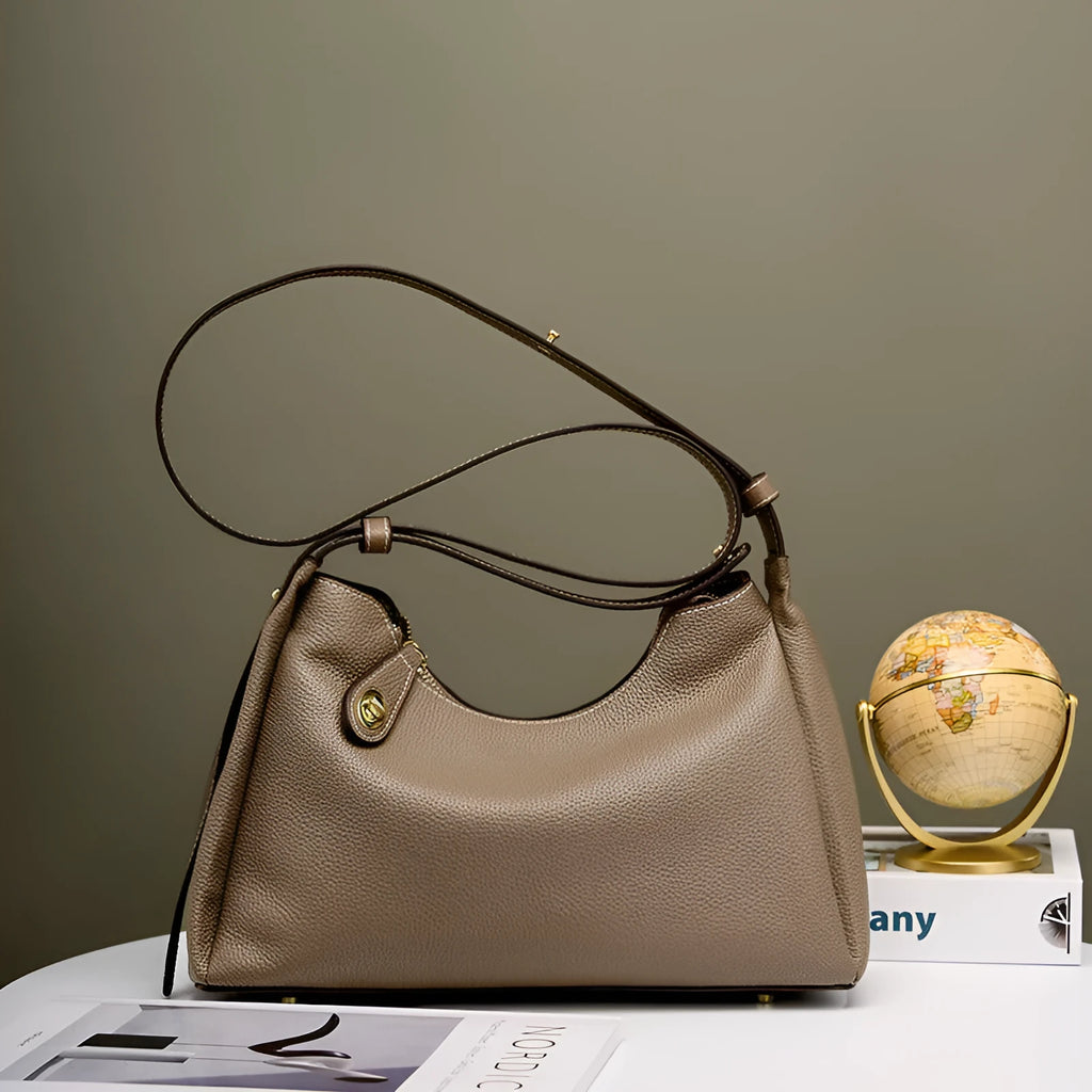 Genuine leather cross body shoulder bag in retro style with zipper closure and internal pockets