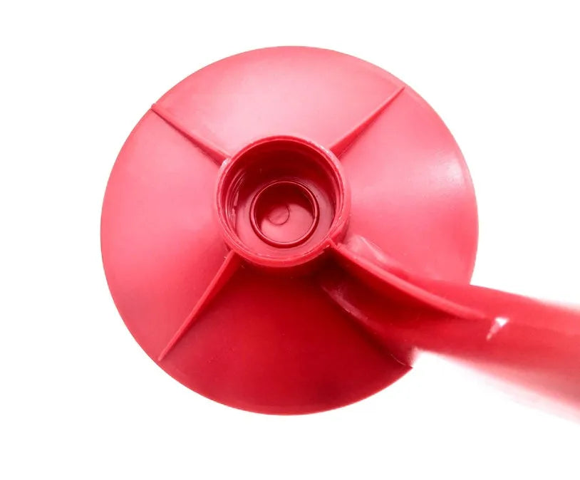 Red plastic Magic Tap soda dispenser attached to inverted 2-litre bottle for push-button drink serving