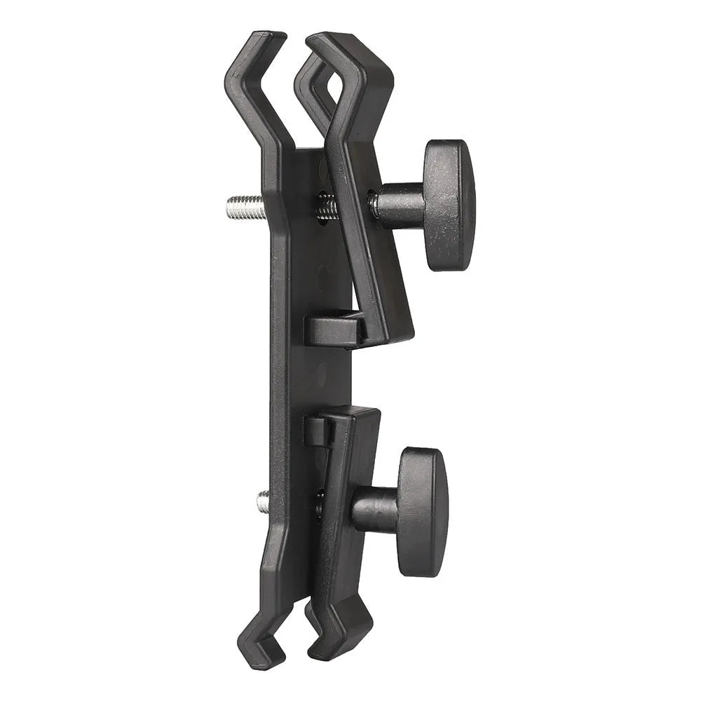 Black ABS umbrella clip attached to camera tripod shaft with umbrella in mounting position