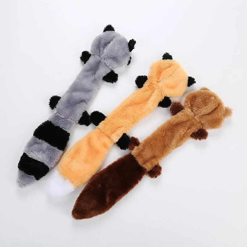 Soft plush dog toy with squeaker in multiple colours including brown, carrot orange, grey, patterned, and yellow options.
