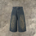 Men's cropped denim shorts with flame embroidery patch in black and blue colours, straight cut for summer street style