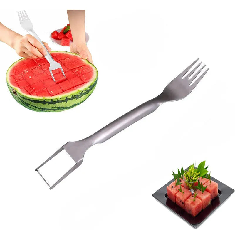 Silver stainless steel watermelon slicer with a 26cm handle and a 3.6cm wide rounded fork head.