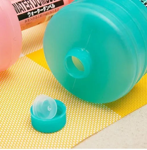 Pair of water-filled fitness dumbbells in pink and green, polypropylene, approximately 1kg each when filled