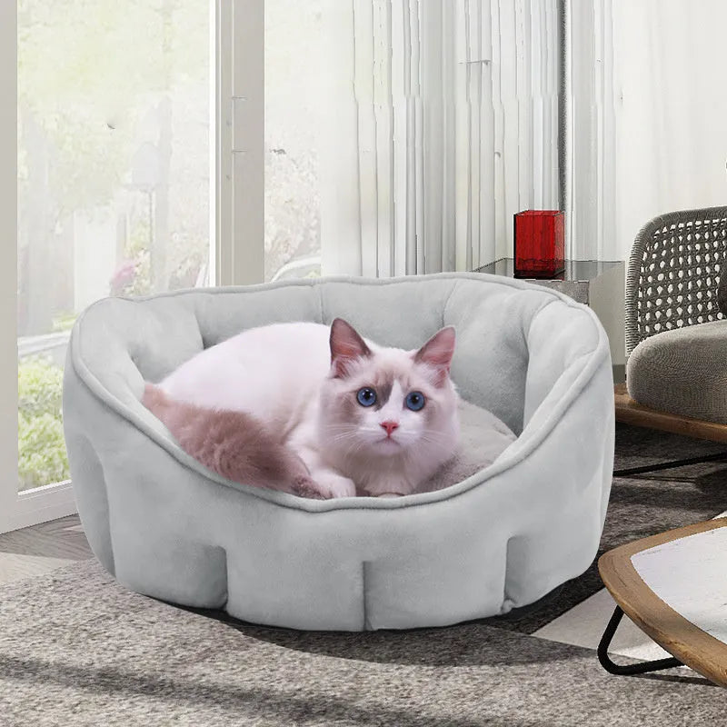 Grey plush cat kennel mat showing enclosed design with raised sides and soft interior.
