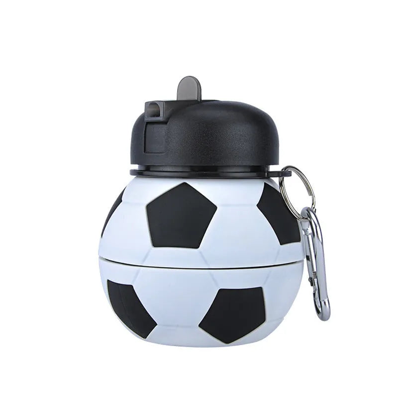 Collapsible white soccer ball shaped silicone water bottle with straw and carrying clip, 18 oz capacity