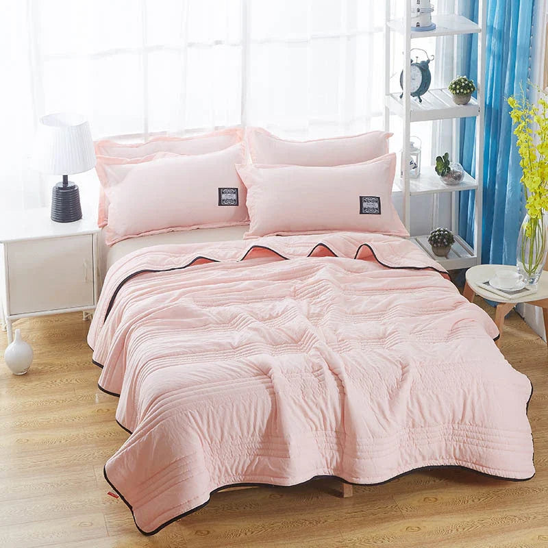 Lightweight, breathable cooling comforter in various colors and sizes for comfortable summer sleep