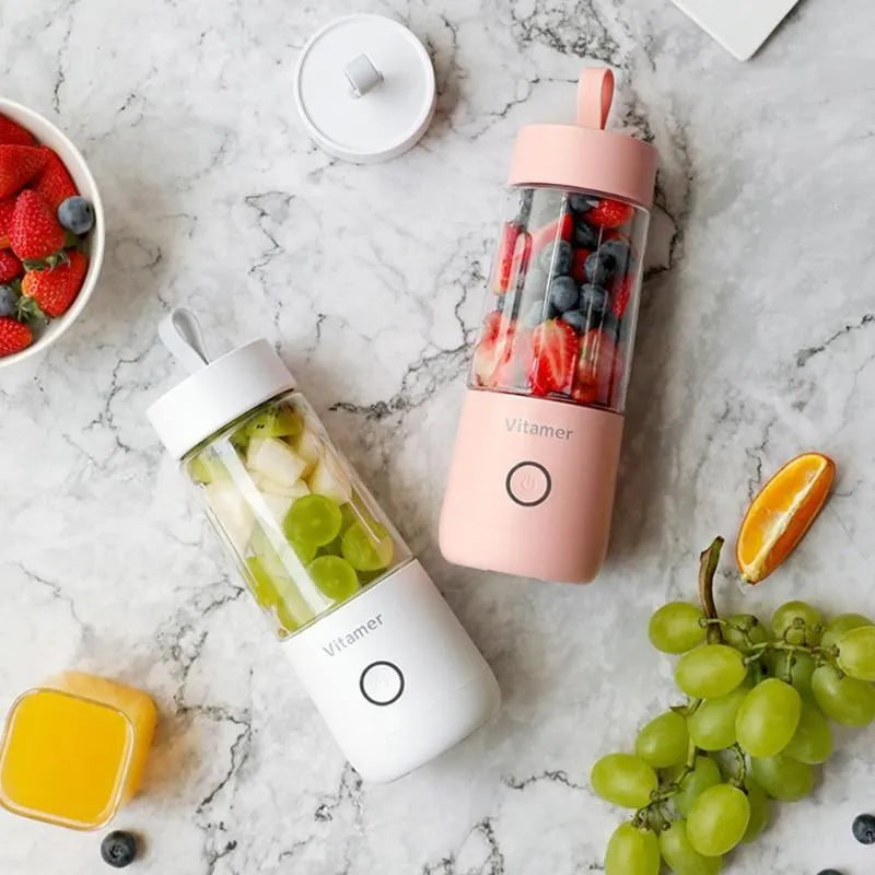 White portable USB blender bottle with silicone handle and stainless steel blade inside.