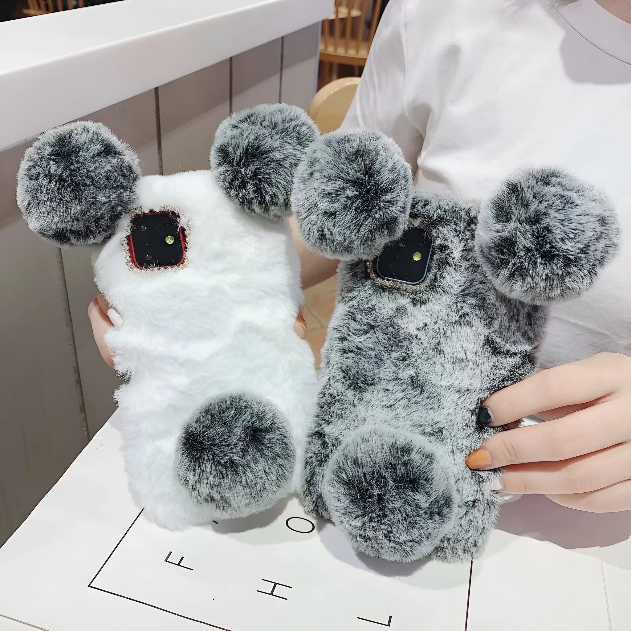 Soft grey bear plush TPU back cover case on an iPhone 11.