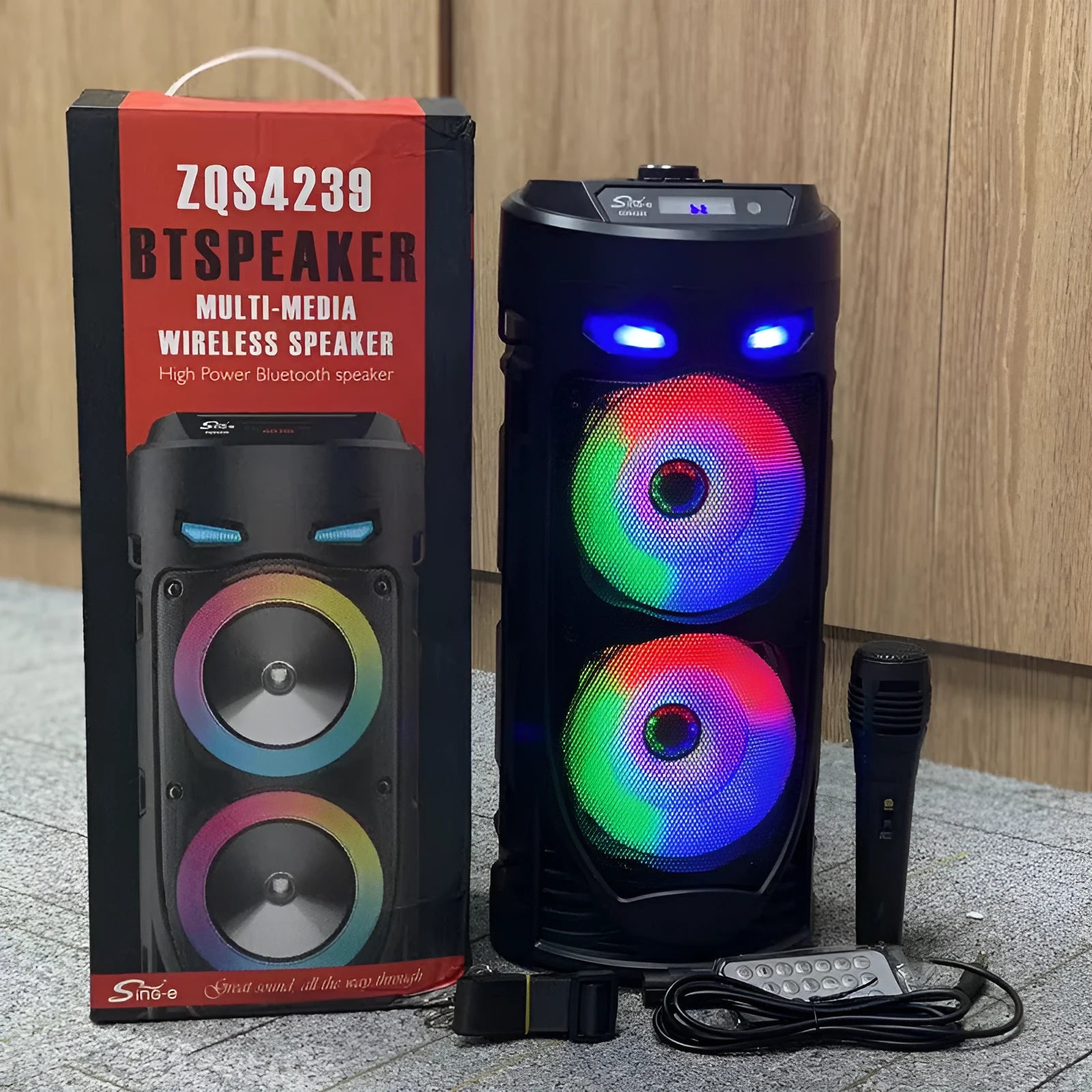 Black portable Bluetooth speaker with dual horn cannon design showing front panel with controls