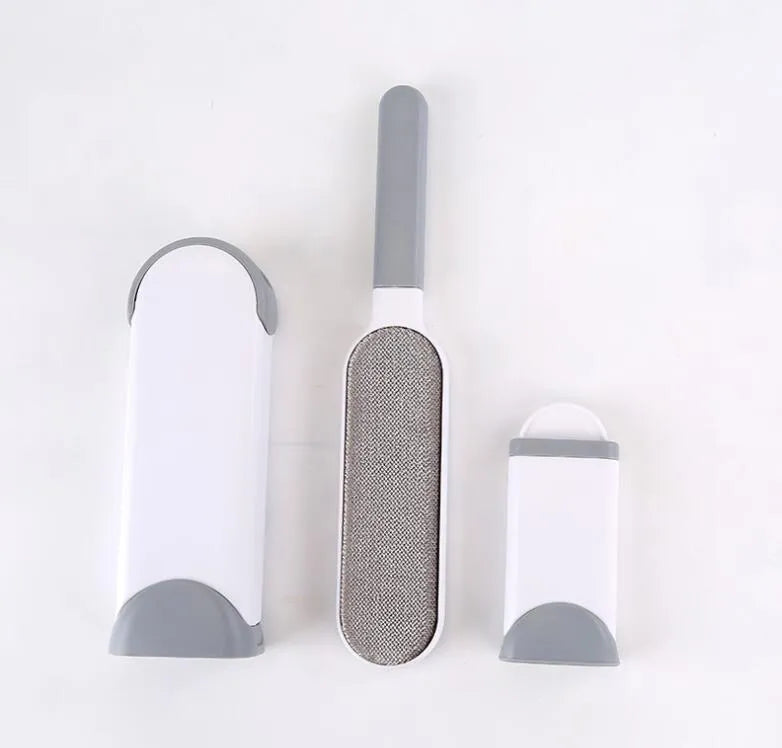 Blue self-cleaning pet hair remover brush with double-sided roller next to its cleaning base.