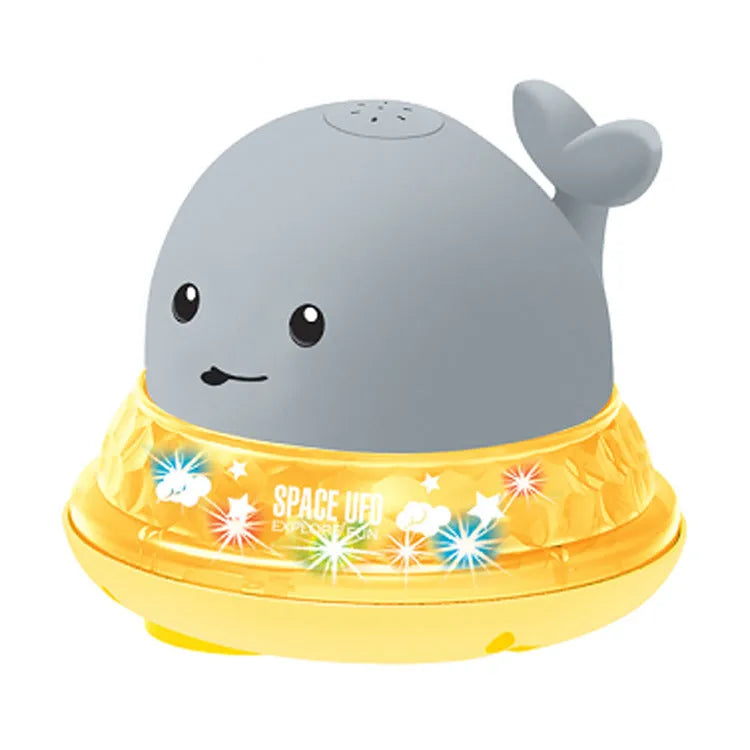 Grey and white whale bath toy spraying water with LED lights flashing