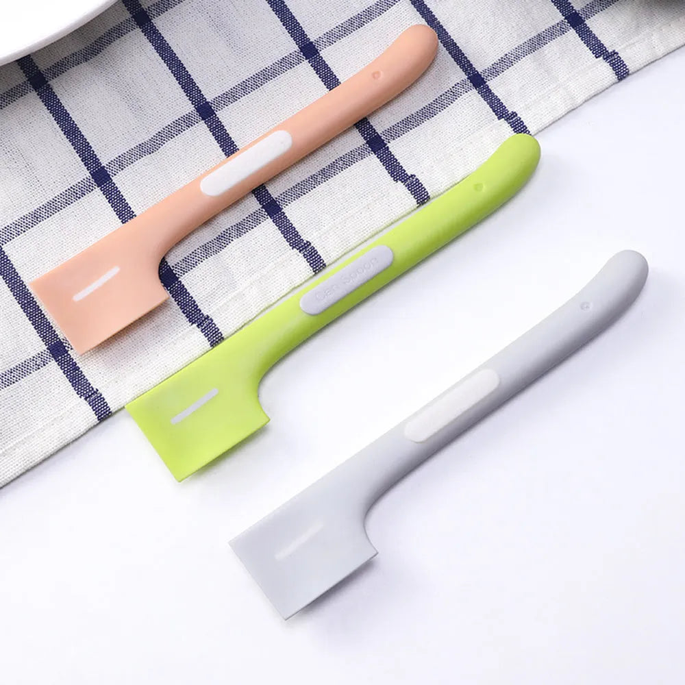 Green TPR pet feeding spoon with long handle and angled scoop for canned food