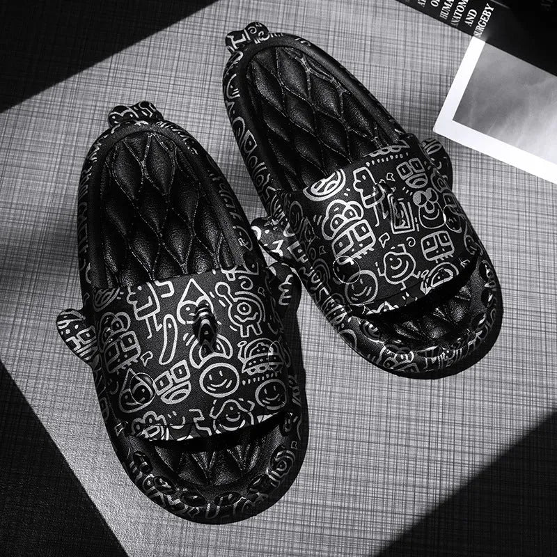 Pair of open-toe EVA slippers with a shark couple design on the footbed.