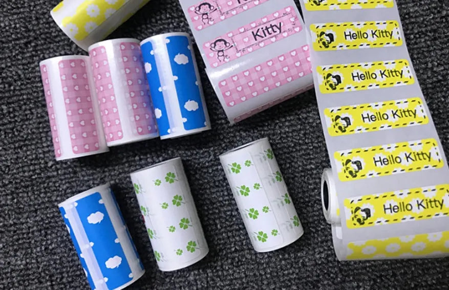PerPage Mini wireless portable thermal printer paper rolls in regular, sticker and label styles, multiple colours