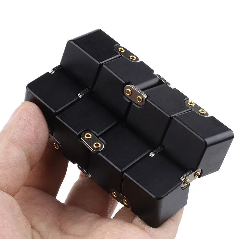 Zinc alloy infinity cube fidget toy in black or silver, showing rotating cubes on a 4cm scale.