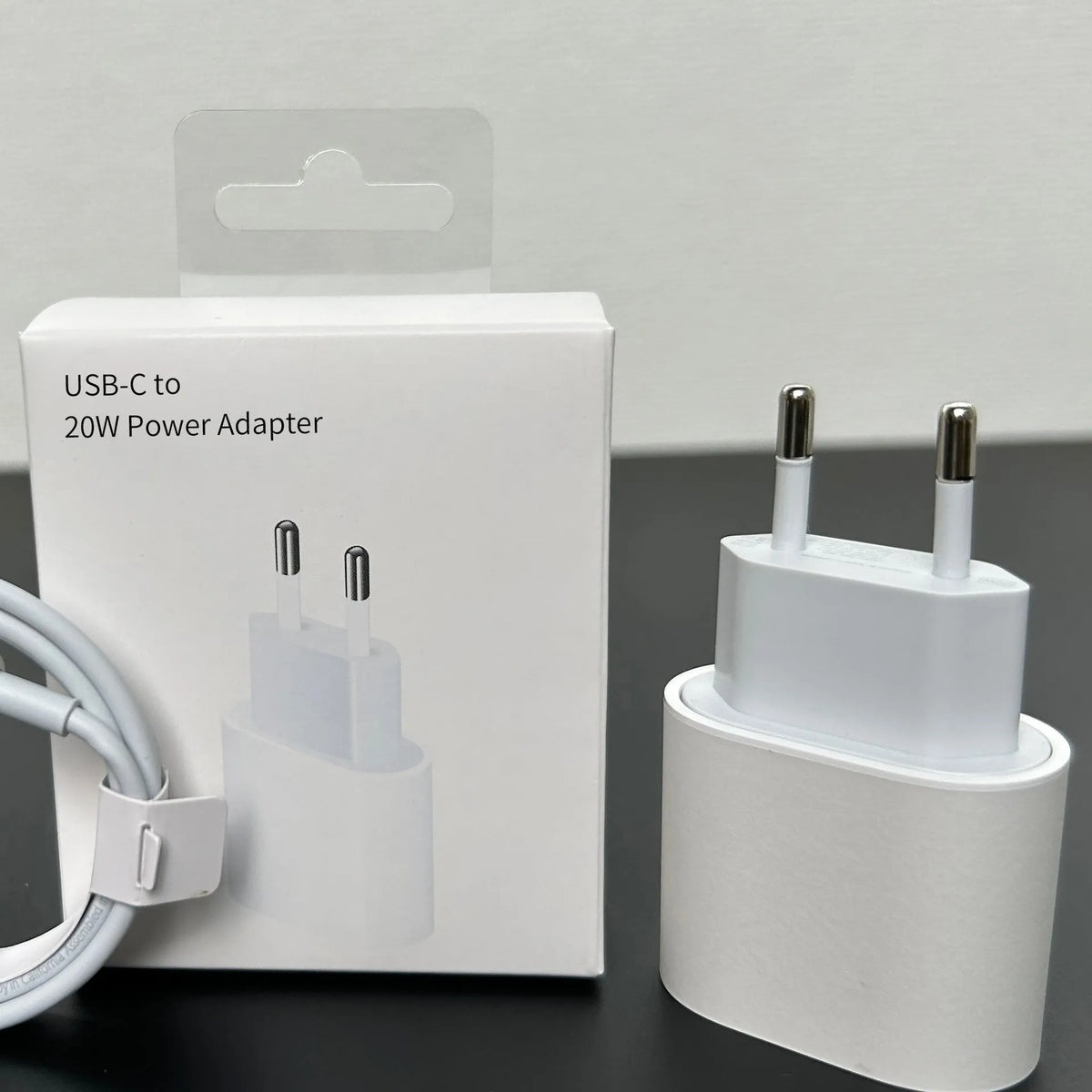 White 20W PD charger with USB-C port and international plug adapters
