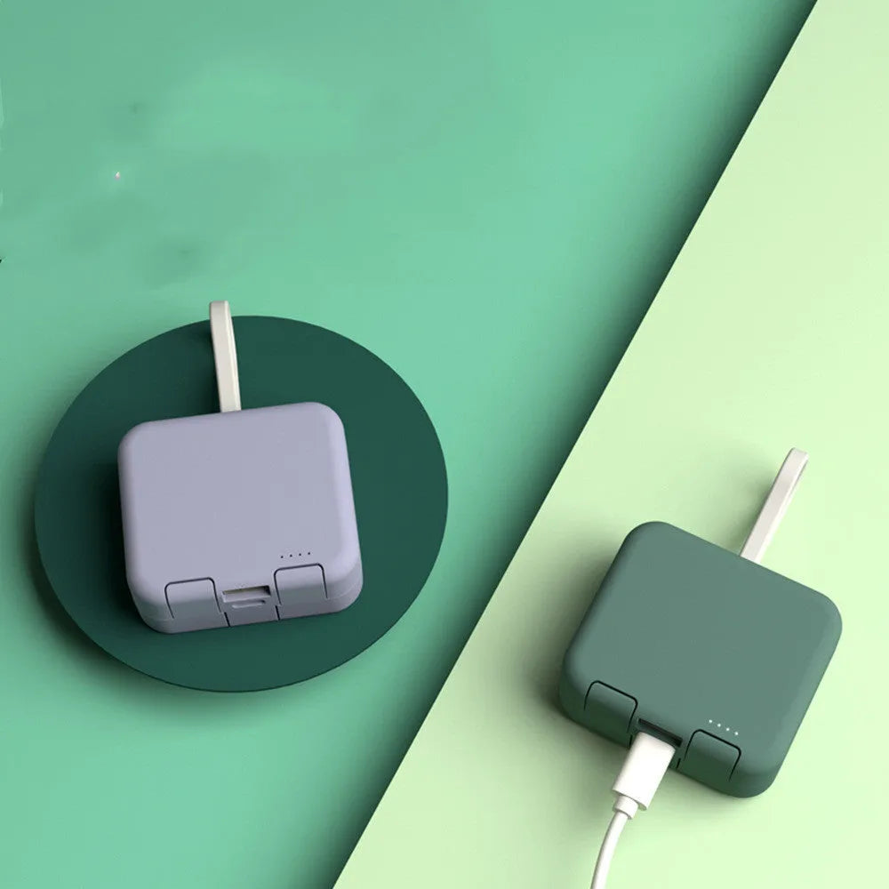 Handbag clip power bank in blue with mobile phone stand function showing charging ports