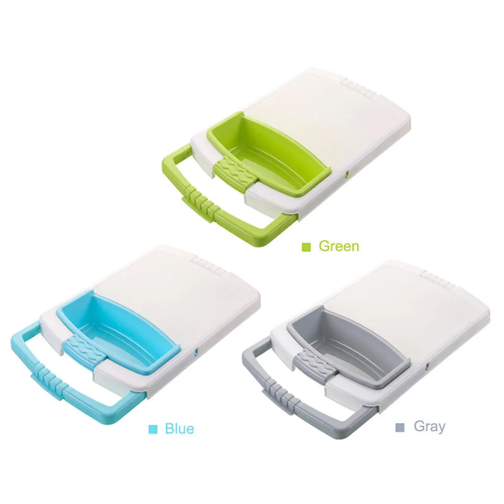 Green sink-mounted kitchen cutting board with drain holes and a storage trough for vegetables.