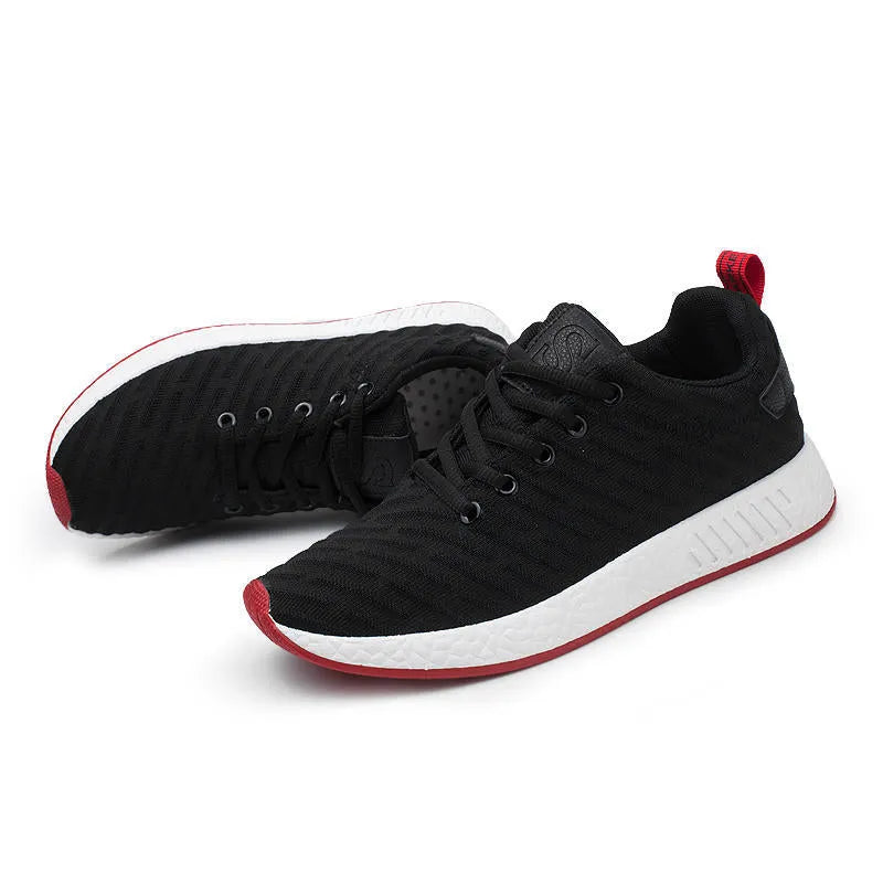 Men Malcolm Sneaker in black from side view showing mesh fabric upper and low-top design