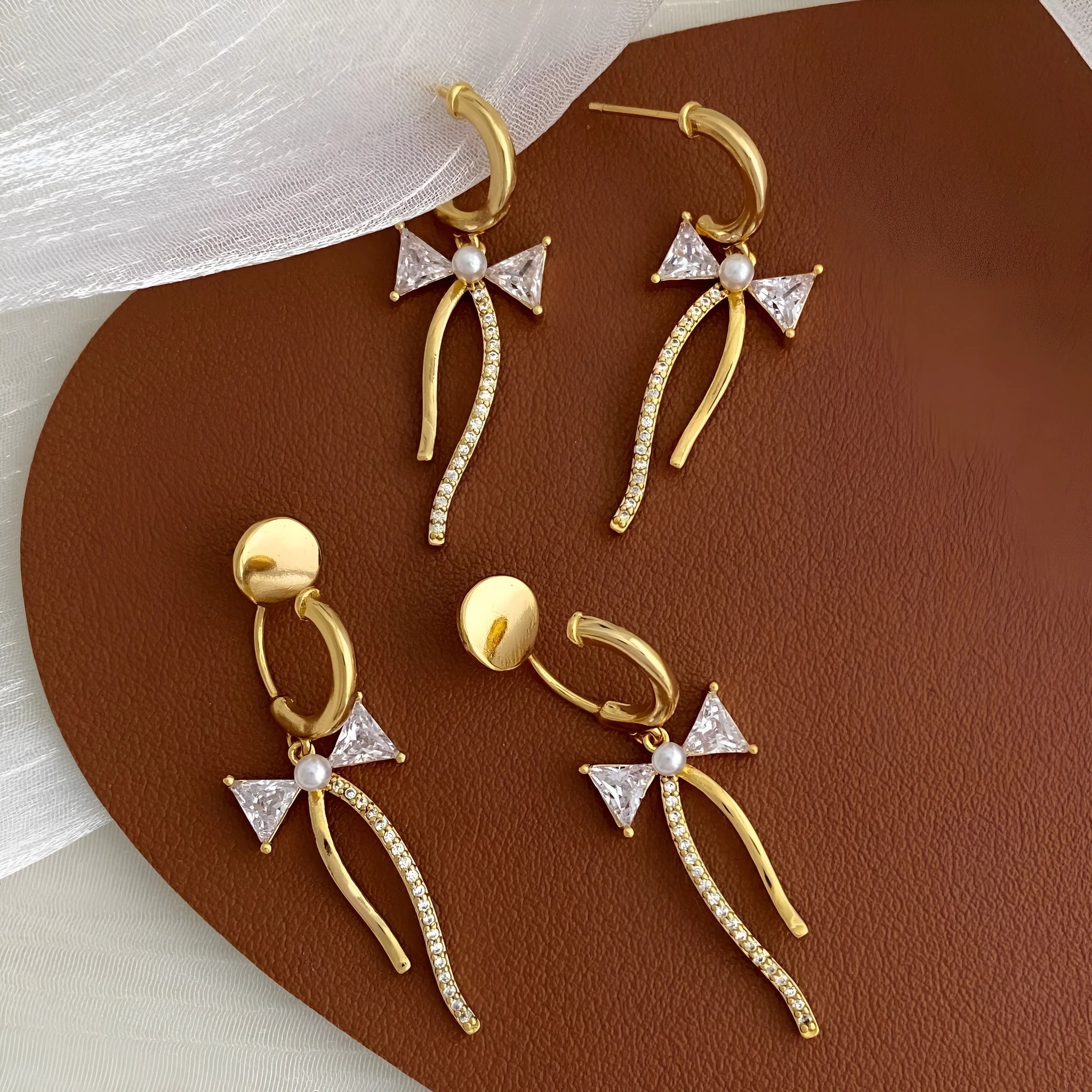 Asymmetric C-shaped earrings with micro-set zirconia, copper finish, ear clip style