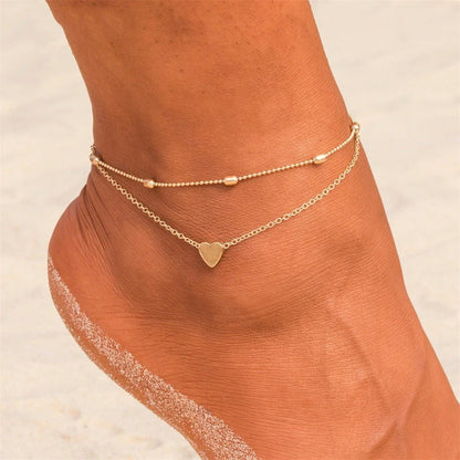 Double-layered heart-shaped anklet with retro beach-inspired chain in gold and silver colors