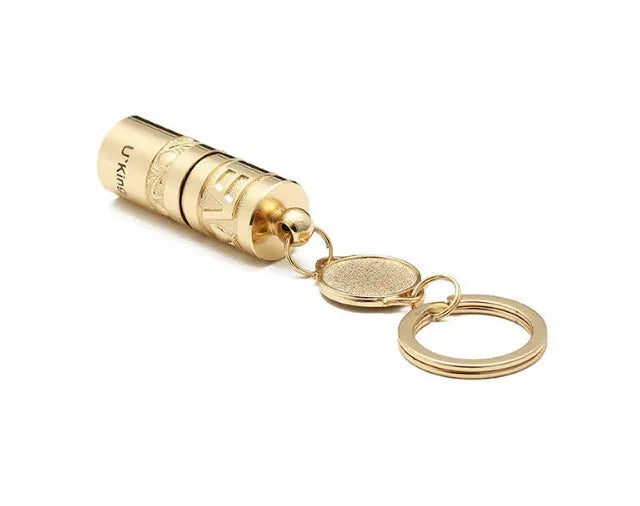 Gold zinc alloy waterproof mini LED flashlight on a keychain ring.