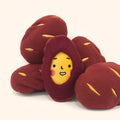 Red sweet potato shaped dog puzzle toy with hidden treat compartment