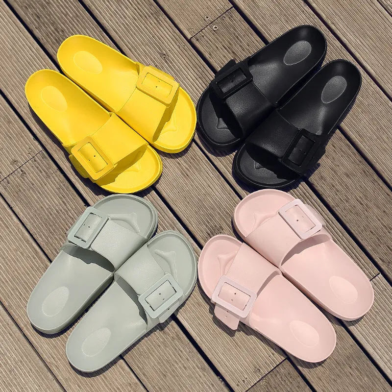 Women's grey blue flip-flop slippers with a buckle strap and soft EVA sole on a light background.