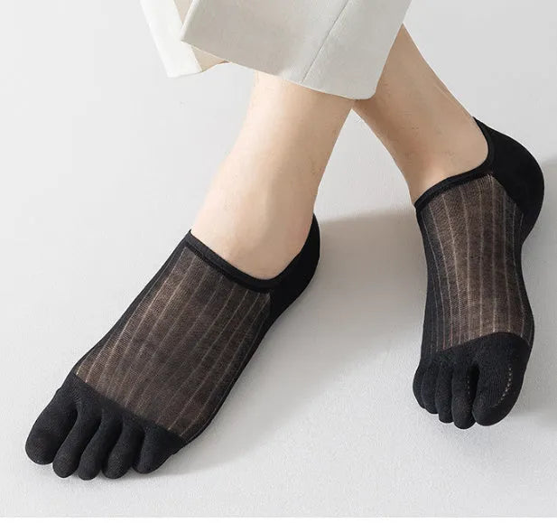Modal cotton five-finger boat socks in black, shown as a pair laid flat to detail the individual toe design.
