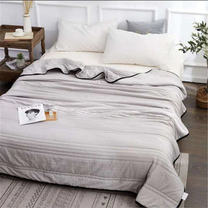 Lightweight, breathable cooling comforter in various colors and sizes for comfortable summer sleep