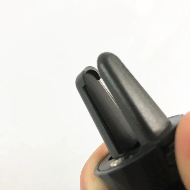 Gloss black car phone holder mounted on vehicle air vent with universal clip mechanism