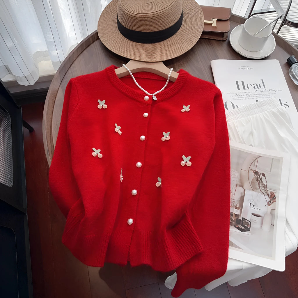 Women's pink cashmere blend cardigan coat with beaded detailing on the round neck, shown open as a slim-fit layer.